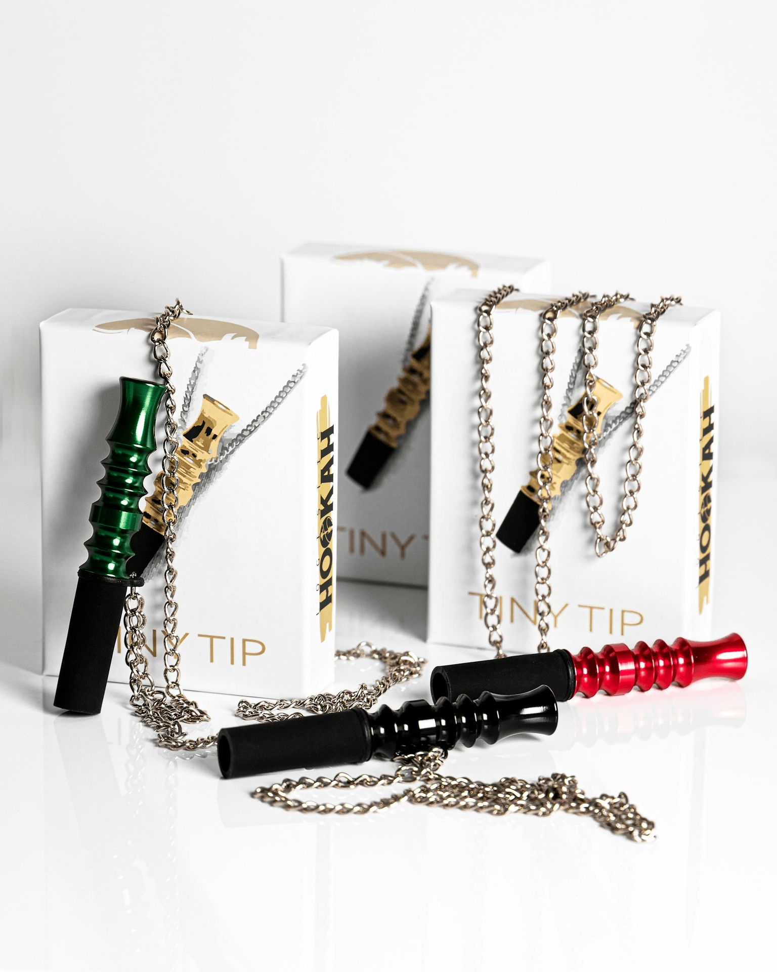 a couple of necklaces sitting on top of a white box